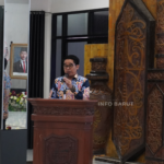 Kepala Dinas Kesehatan Kabupaten Barito Utara, Simamoraturahman, S.E., M.S, saat menyampaikan sambutan dalam kegiatan Seminar Ilmiah dan Pelantikan Pengurus IDI Cabang Barito Utara masa bakti 2025–2028 di GPU Balai Antang, Muara Teweh, Minggu (24/5/2026). (Foto: Indra Tamara/infobarut.com).